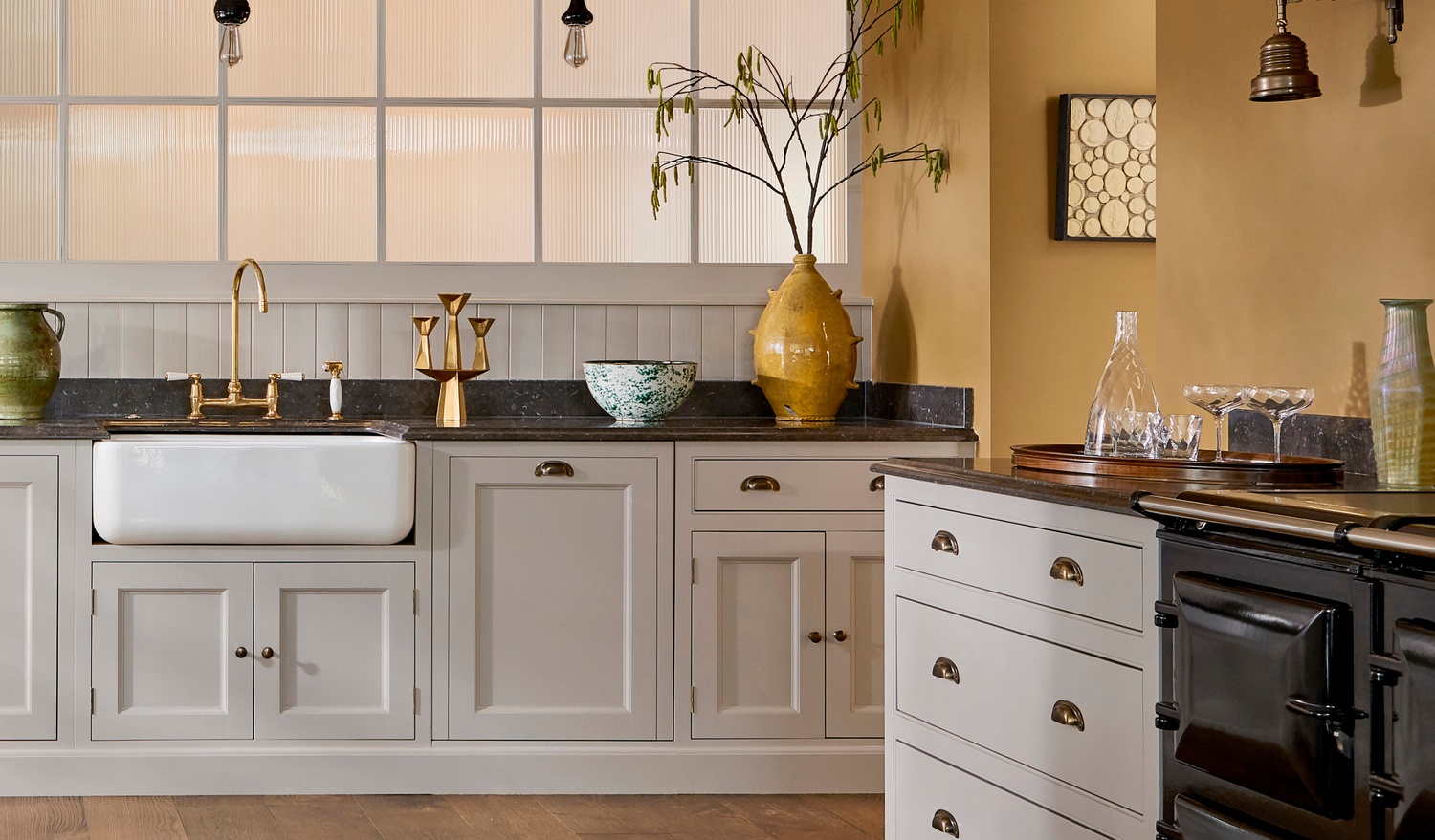 White kitchen units with yellow wall